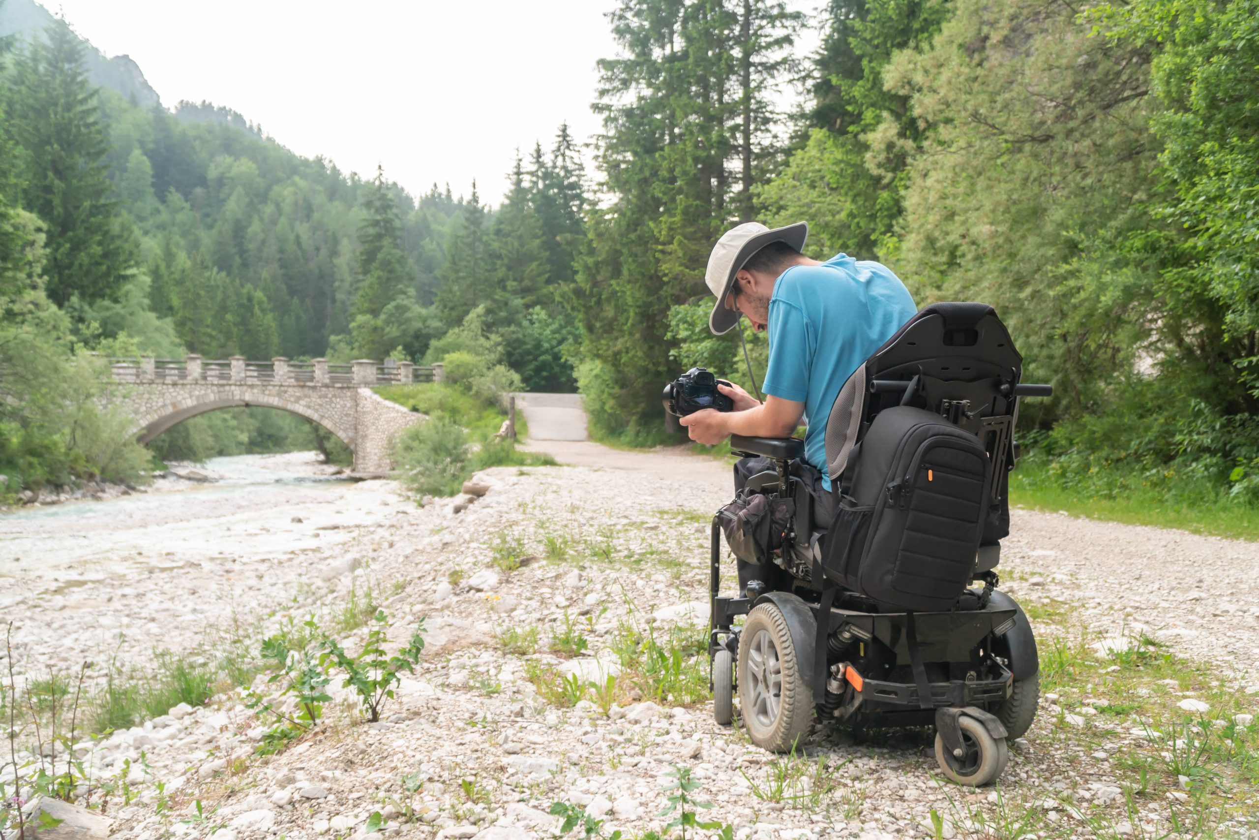 photographer-min photographer in powerchair taking a picture of a bridge